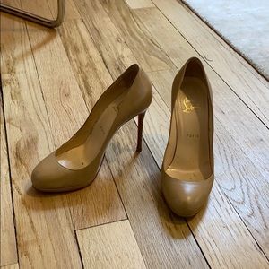 Nude Louboutin pumps. With dust bag